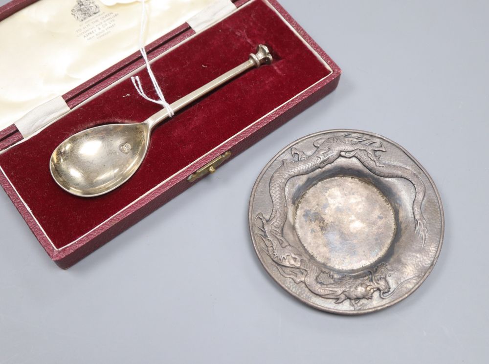 An Asprey silver spoon and a Japanese white metal dragon dish, marked pure silver